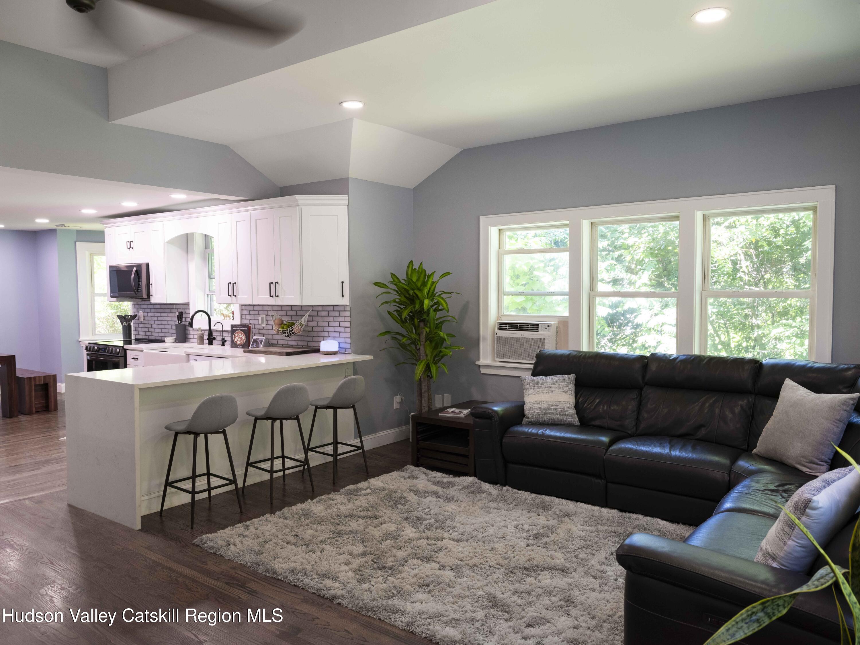 159 Ketchamtown Road Wappingers Falls, NY 12590 - Photo 11 of 31 a living room with furniture and a large window
