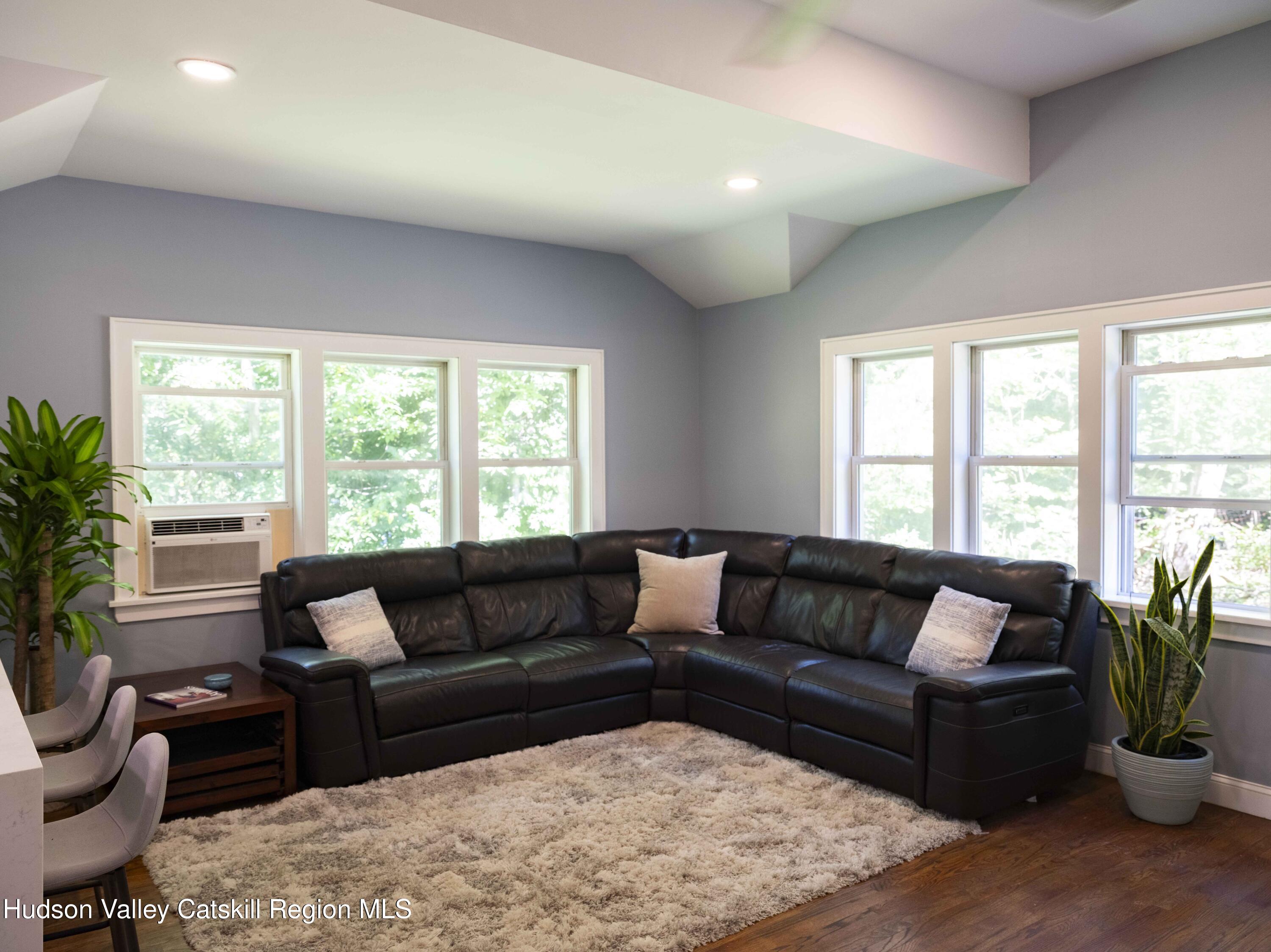 159 Ketchamtown Road Wappingers Falls, NY 12590 - Photo 12 of 31 a living room with furniture and a large window