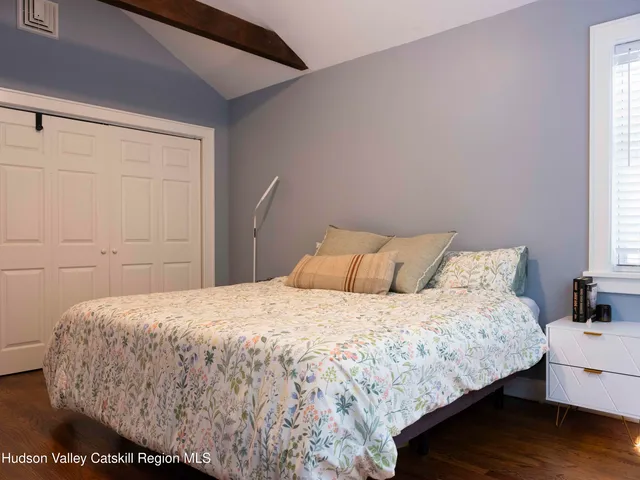 a bedroom with a bed and window