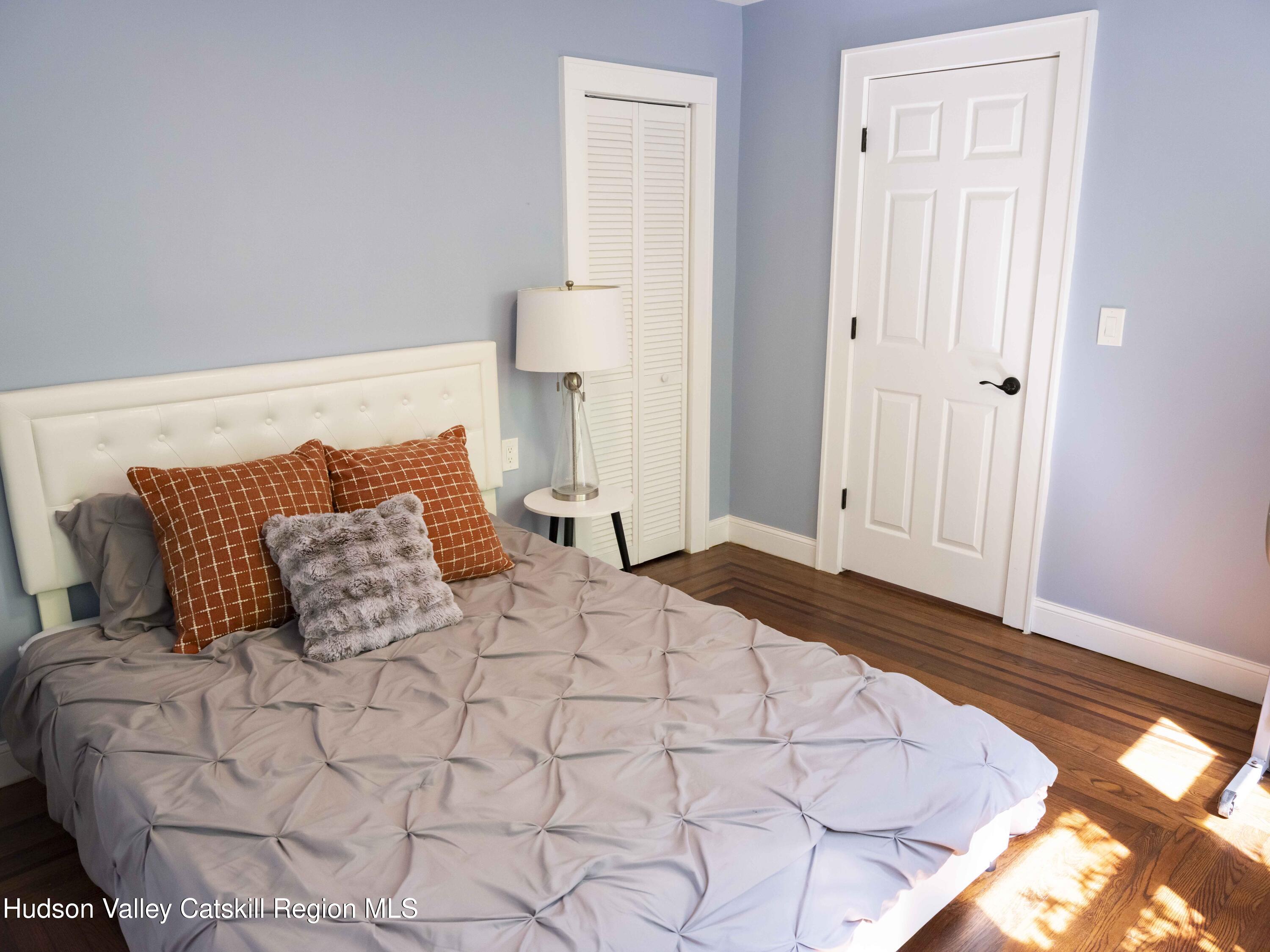 159 Ketchamtown Road Wappingers Falls, NY 12590 - Photo 16 of 31 a bedroom with a bed and a night stand