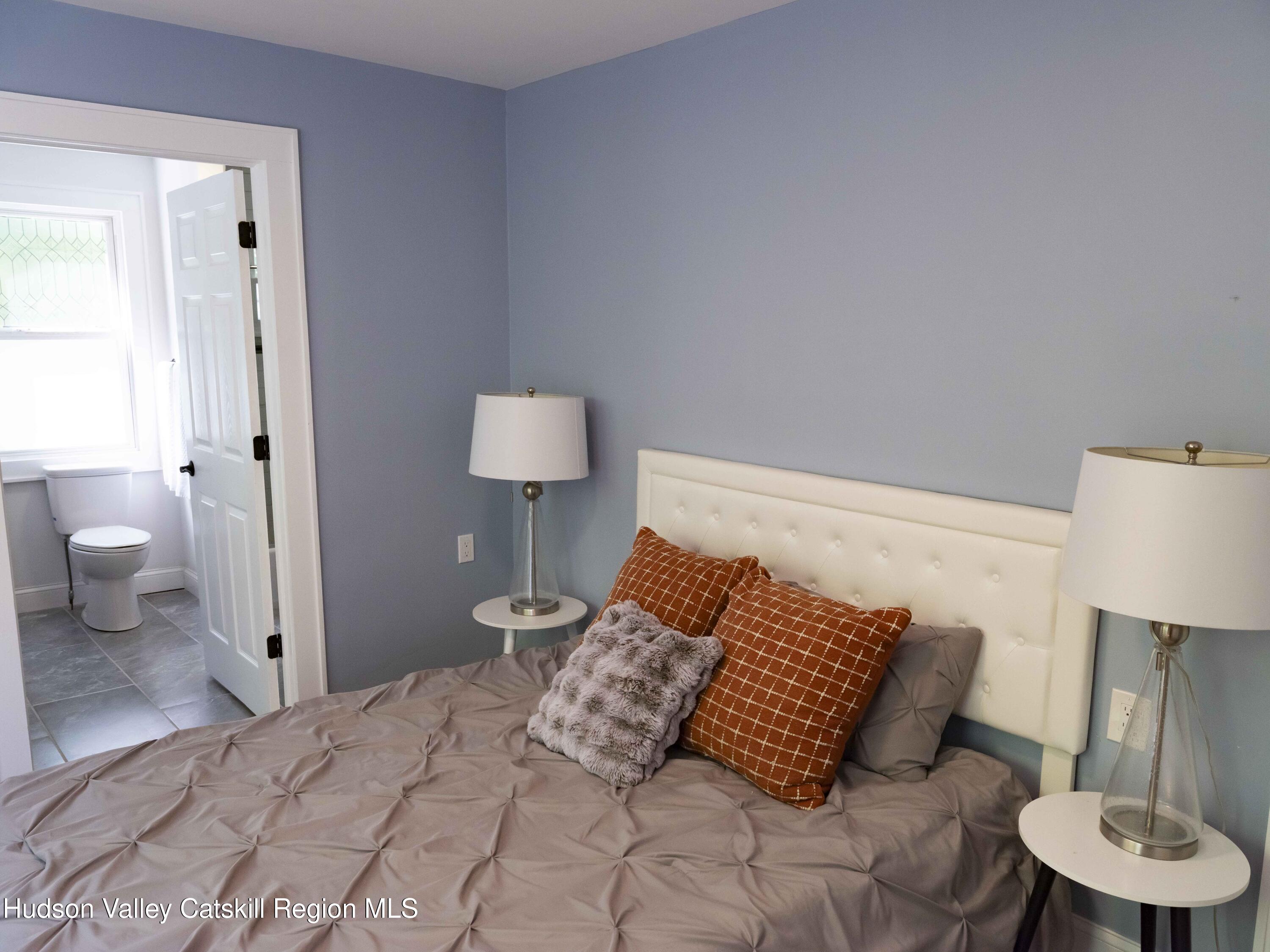 159 Ketchamtown Road Wappingers Falls, NY 12590 - Photo 17 of 31 a bedroom with a bed and a couch