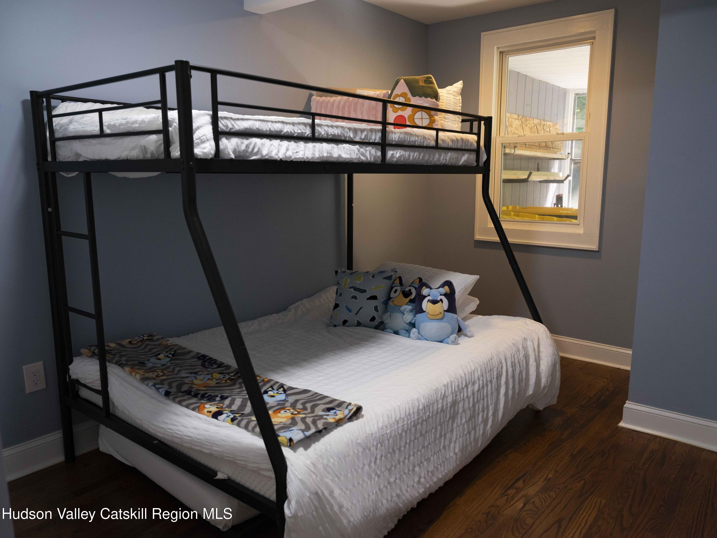 159 Ketchamtown Road Wappingers Falls, NY 12590 - Photo 19 of 31 a bed sitting in a bedroom next to a window