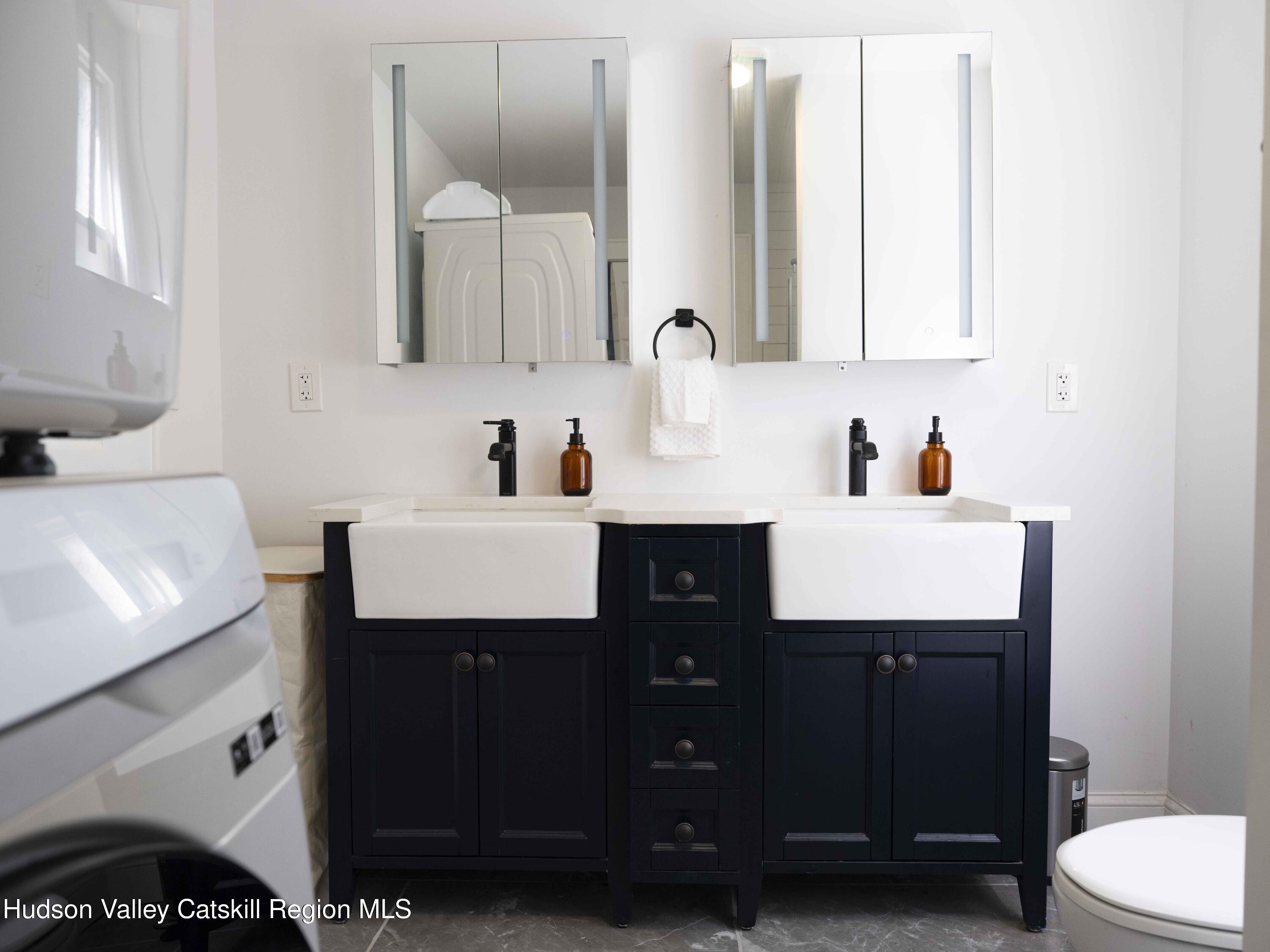 159 Ketchamtown Road Wappingers Falls, NY 12590 - Photo 22 of 31 a bathroom with a sink vanity and a mirror