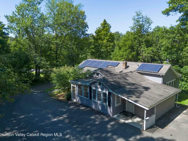 a view of a wooden deck and a yard