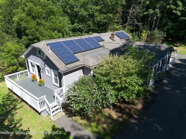 a view of a patio with table and chairs and potted plants