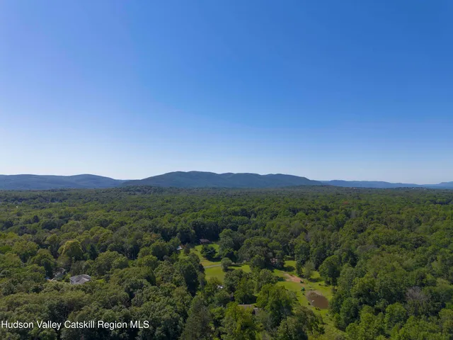 a view of a town with mountains in the background