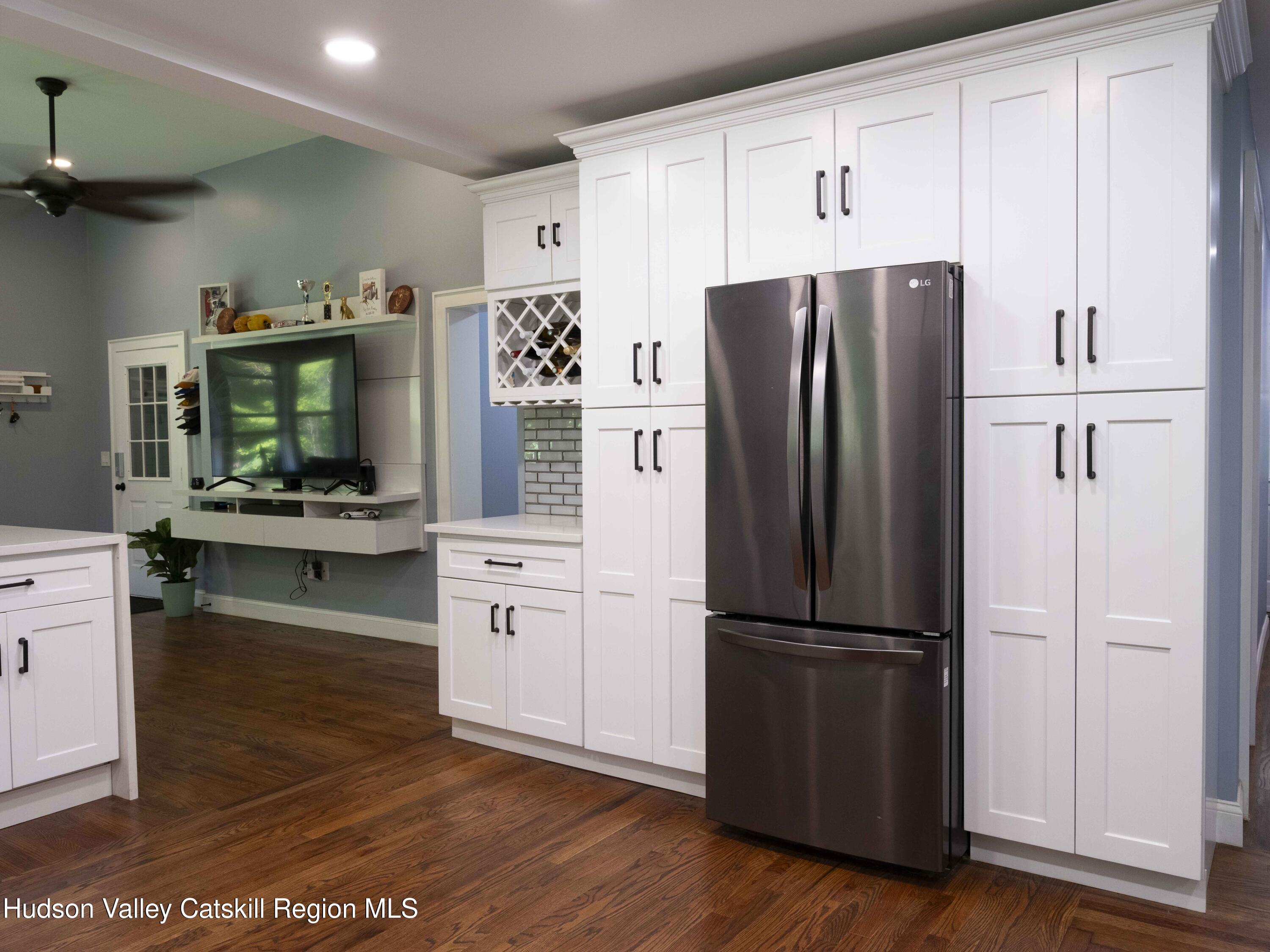 159 Ketchamtown Road Wappingers Falls, NY 12590 - Photo 7 of 31 a kitchen with granite countertop stainless steel appliances a refrigerator and cabinets