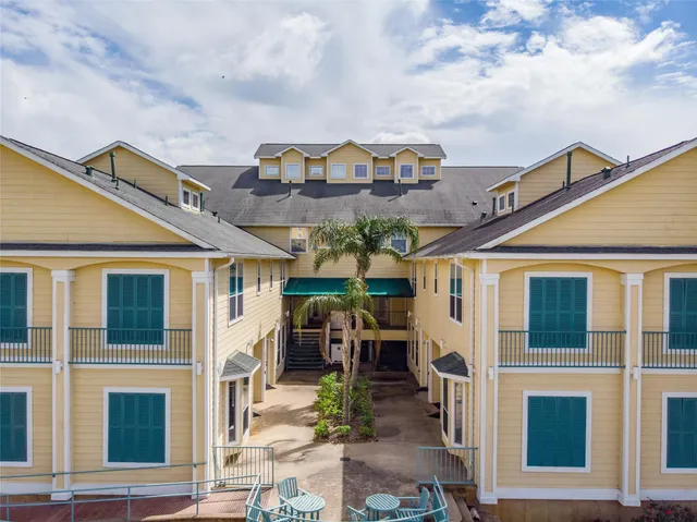 a large building with a clock on the front door