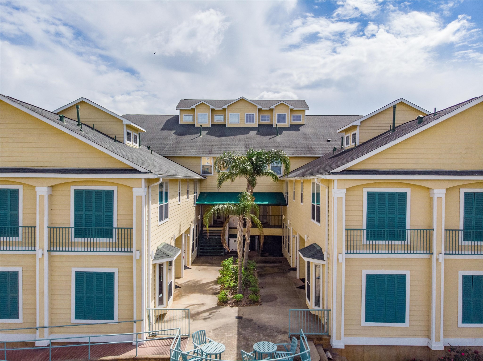 811 Bradford Avenue, Unit 5B Kemah, TX 77565 - Photo 21 of 22 a large building with a clock on the front door