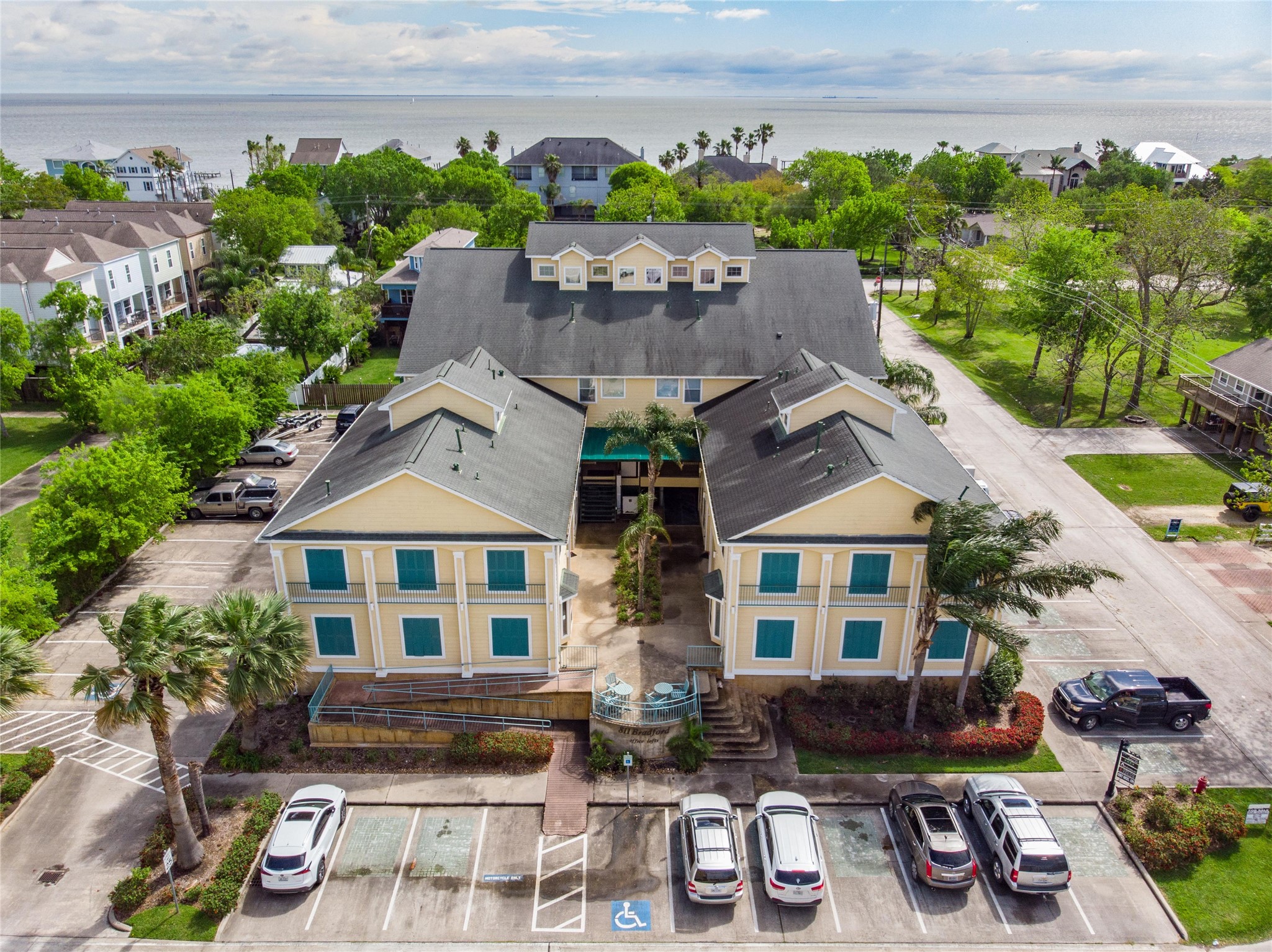 811 Bradford Avenue, Unit 5B Kemah, TX 77565 - Photo 22 of 22 a front view of a house with garden