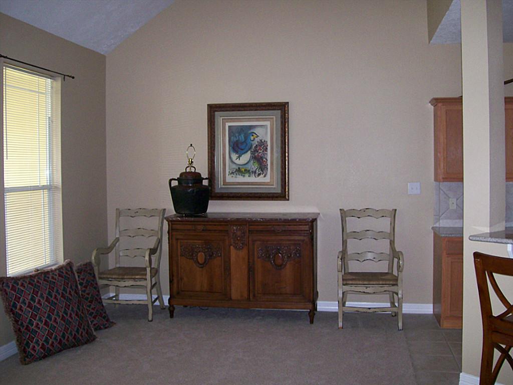 811 Bradford Avenue, Unit 5B Kemah, TX 77565 - Photo 6 of 22 a bed room with furniture and a window