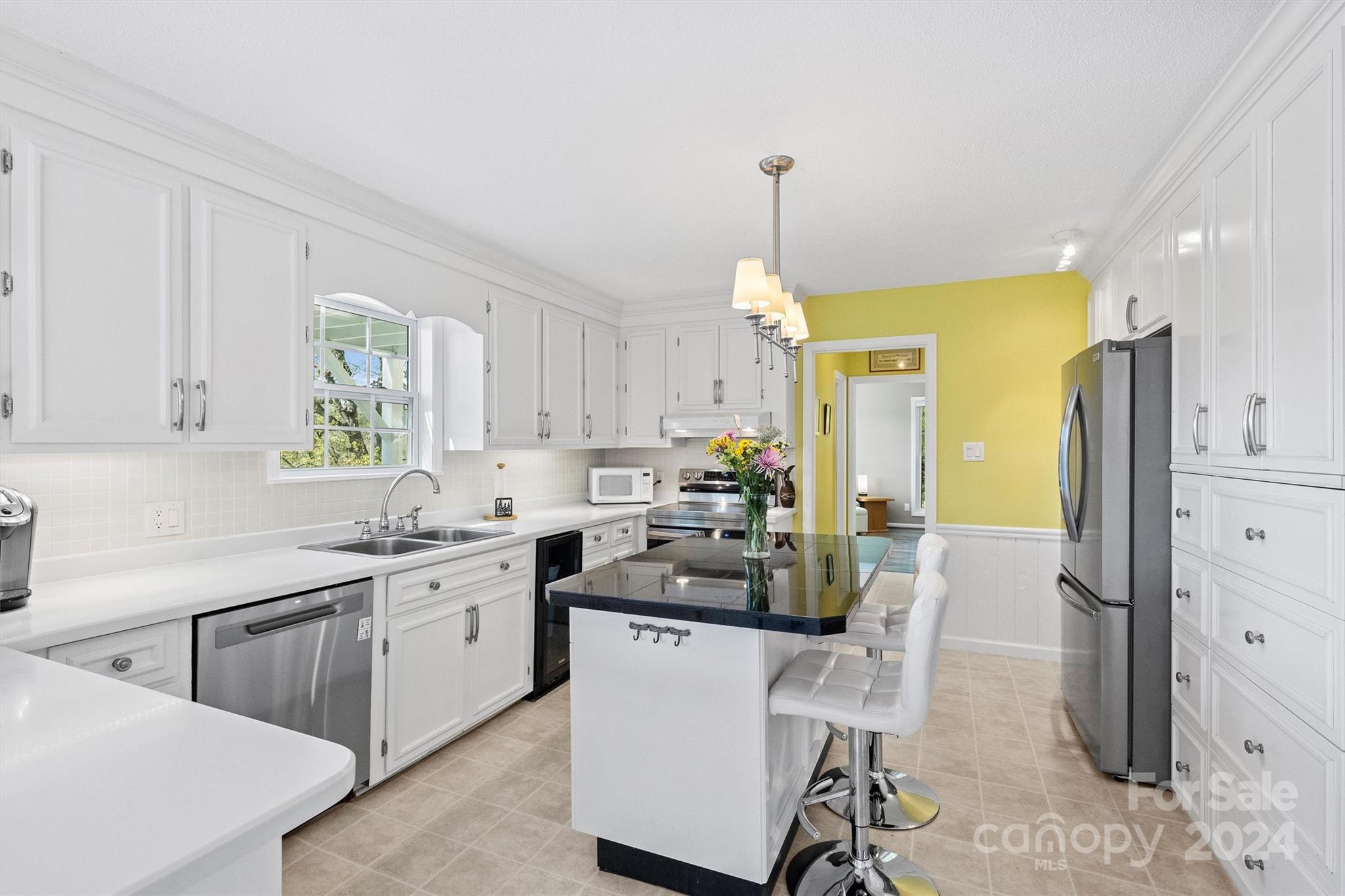 1190 Molokai Drive Tega Cay, SC 29708 - Photo 14 of 46 a kitchen that has a lot of cabinets in it and appliances
