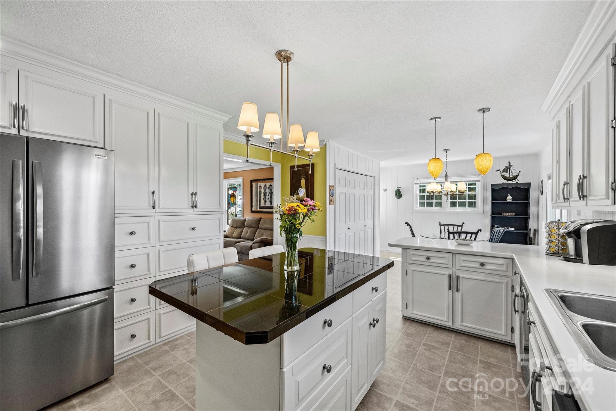 1190 Molokai Drive Tega Cay, SC 29708 - Photo 15 of 46 a kitchen with stainless steel appliances granite countertop a sink a stove a refrigerator and island