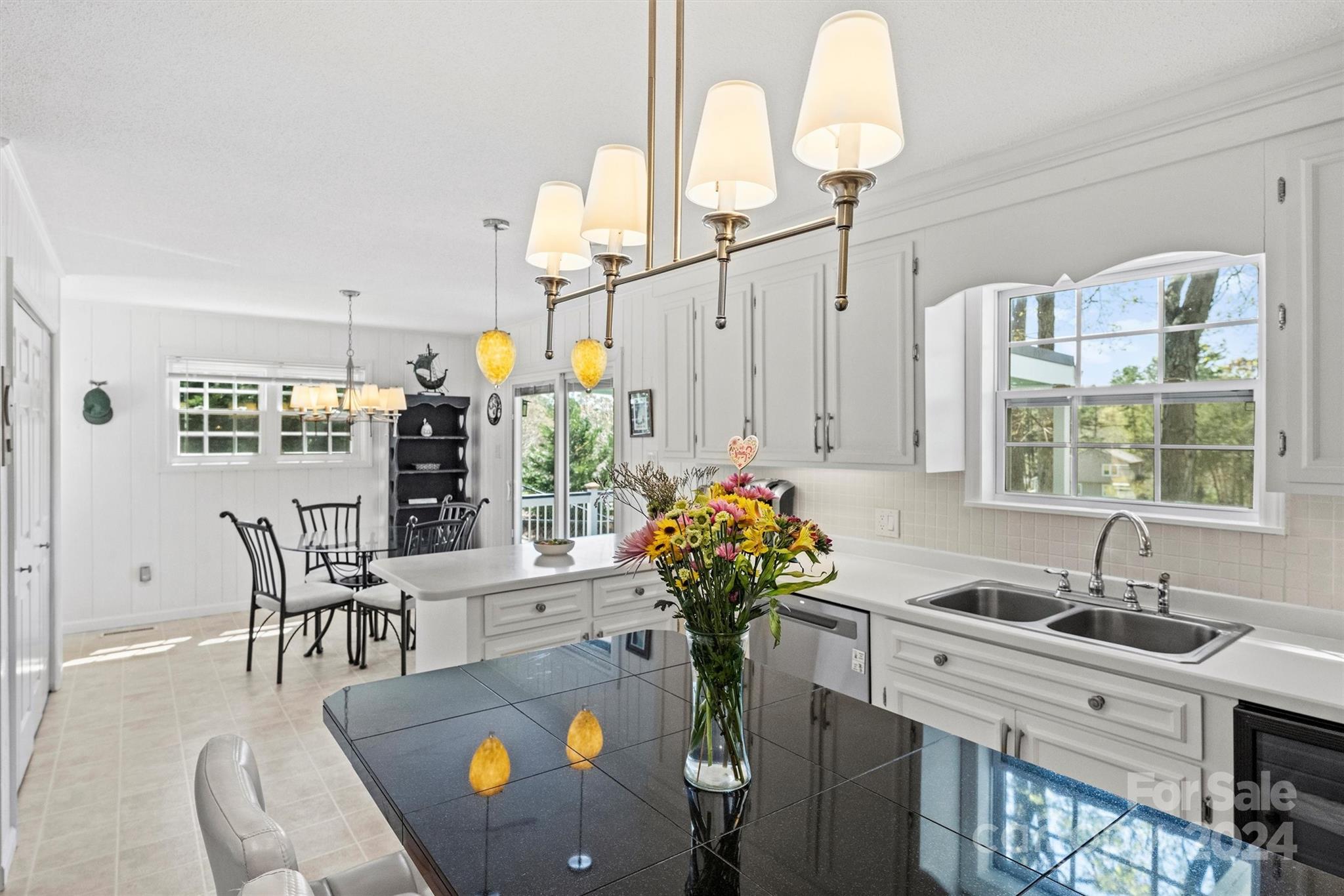 1190 Molokai Drive Tega Cay, SC 29708 - Photo 16 of 46 a kitchen with stainless steel appliances granite countertop a sink and cabinets