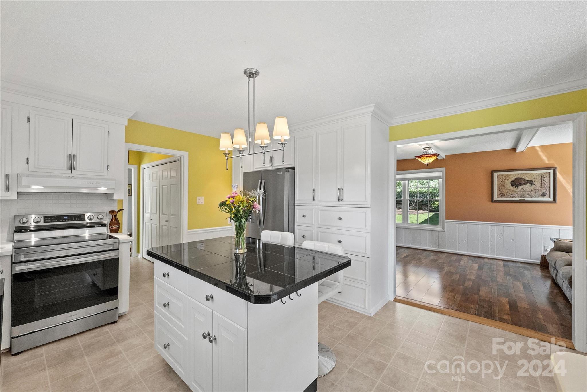 1190 Molokai Drive Tega Cay, SC 29708 - Photo 17 of 46 a kitchen with stainless steel appliances granite countertop a sink a stove and a refrigerator