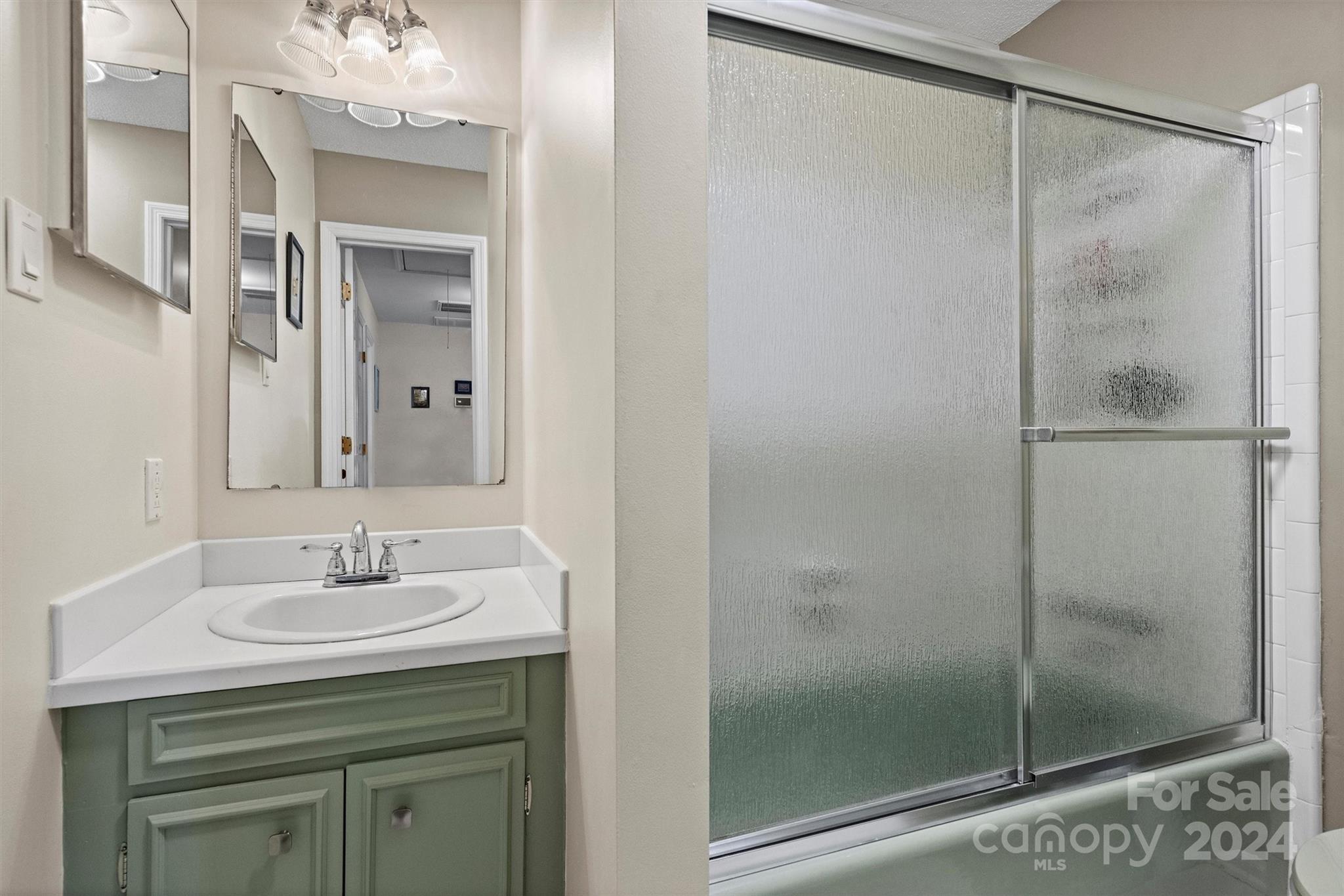 1190 Molokai Drive Tega Cay, SC 29708 - Photo 28 of 46 a bathroom with a shower sink and mirror