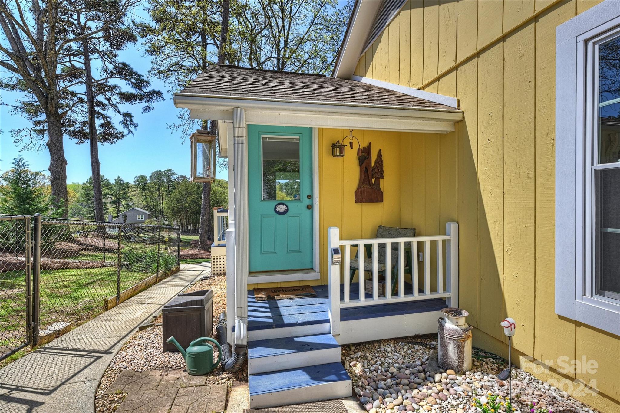 1190 Molokai Drive Tega Cay, SC 29708 - Photo 3 of 46 a view of a porch with a floor to ceiling window next to a yard
