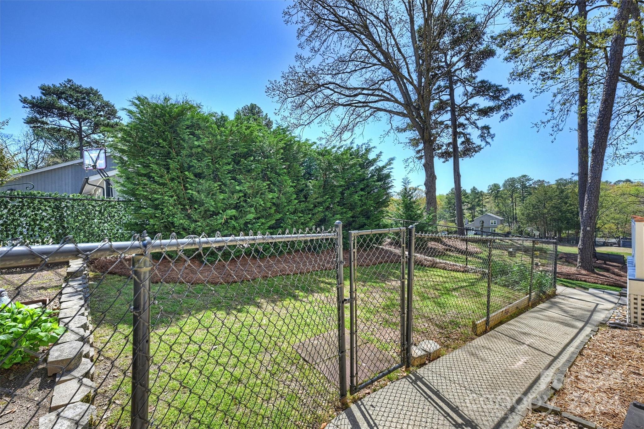 1190 Molokai Drive Tega Cay, SC 29708 - Photo 35 of 46 a view of a swimming pool with a patio and a yard