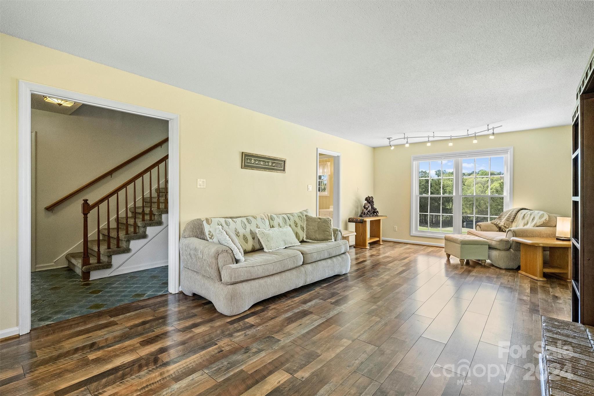 1190 Molokai Drive Tega Cay, SC 29708 - Photo 9 of 46 a living room with furniture and a large window