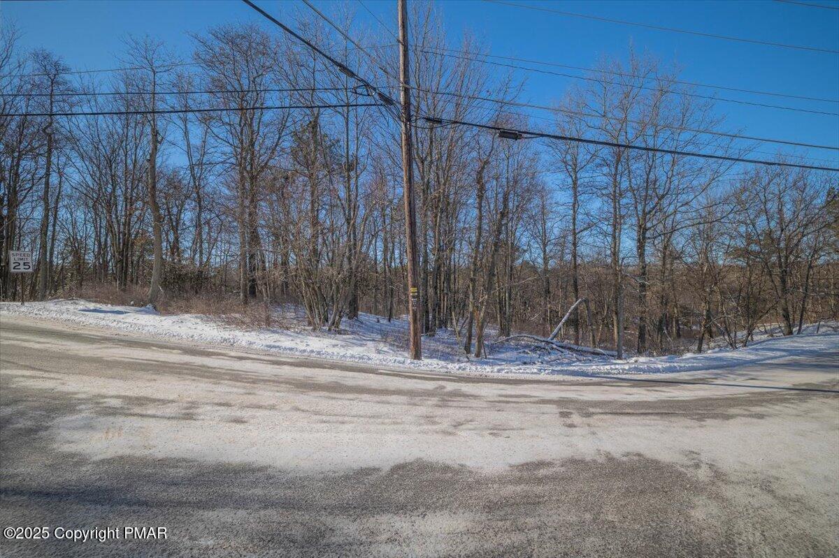 7237 Clover Road Long Pond, PA 18334 - Photo 3 of 7 a view of a backyard with wooden fence