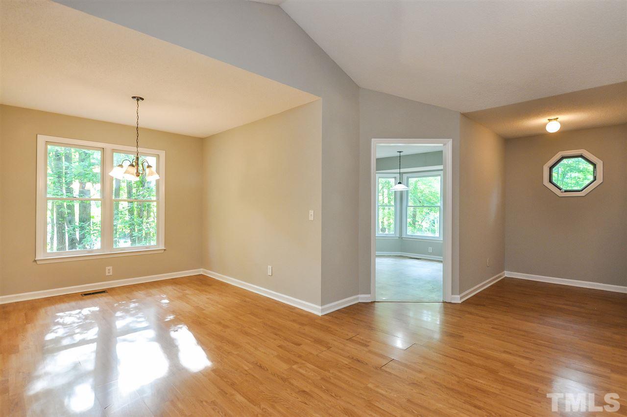 5208 Relay Way Raleigh, NC 27603 - Photo 12 of 25 an empty room with wooden floor and windows