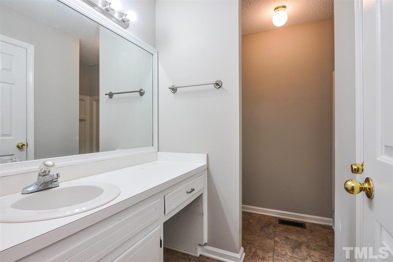 5208 Relay Way Raleigh, NC 27603 - Photo 16 of 25 a bathroom with a sink and a mirror