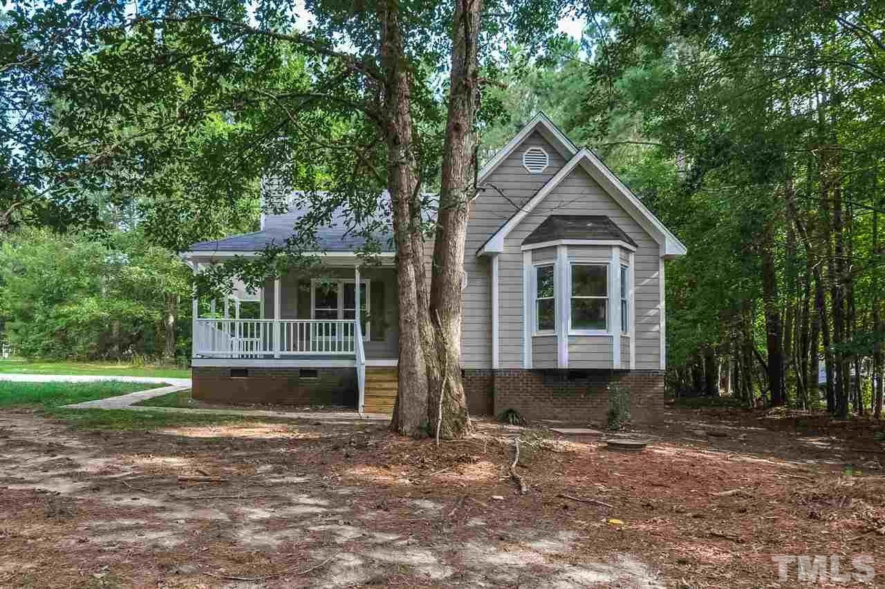5208 Relay Way Raleigh, NC 27603 - Photo 22 of 25 a front view of a house with a garden