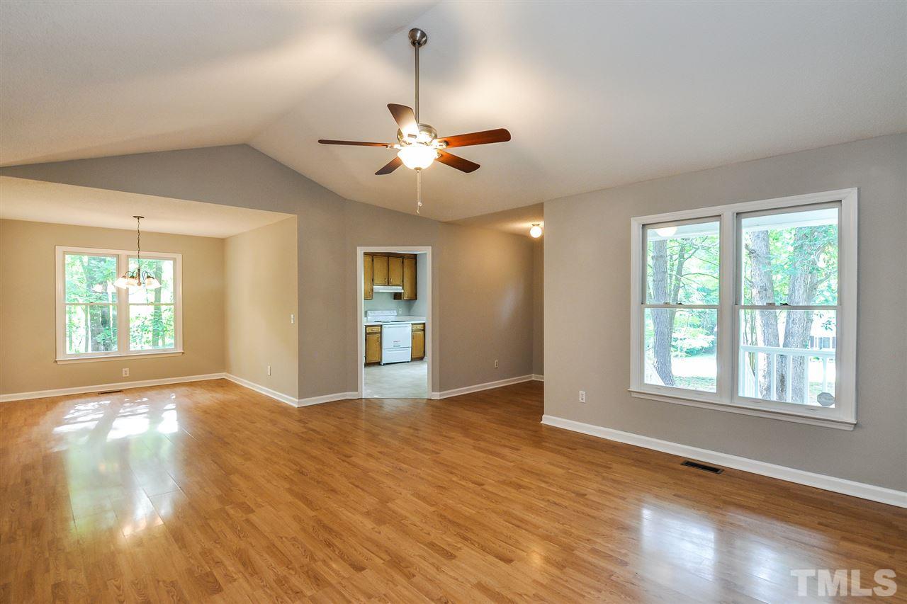 5208 Relay Way Raleigh, NC 27603 - Photo 4 of 25 a view of an empty room with window and wooden floor