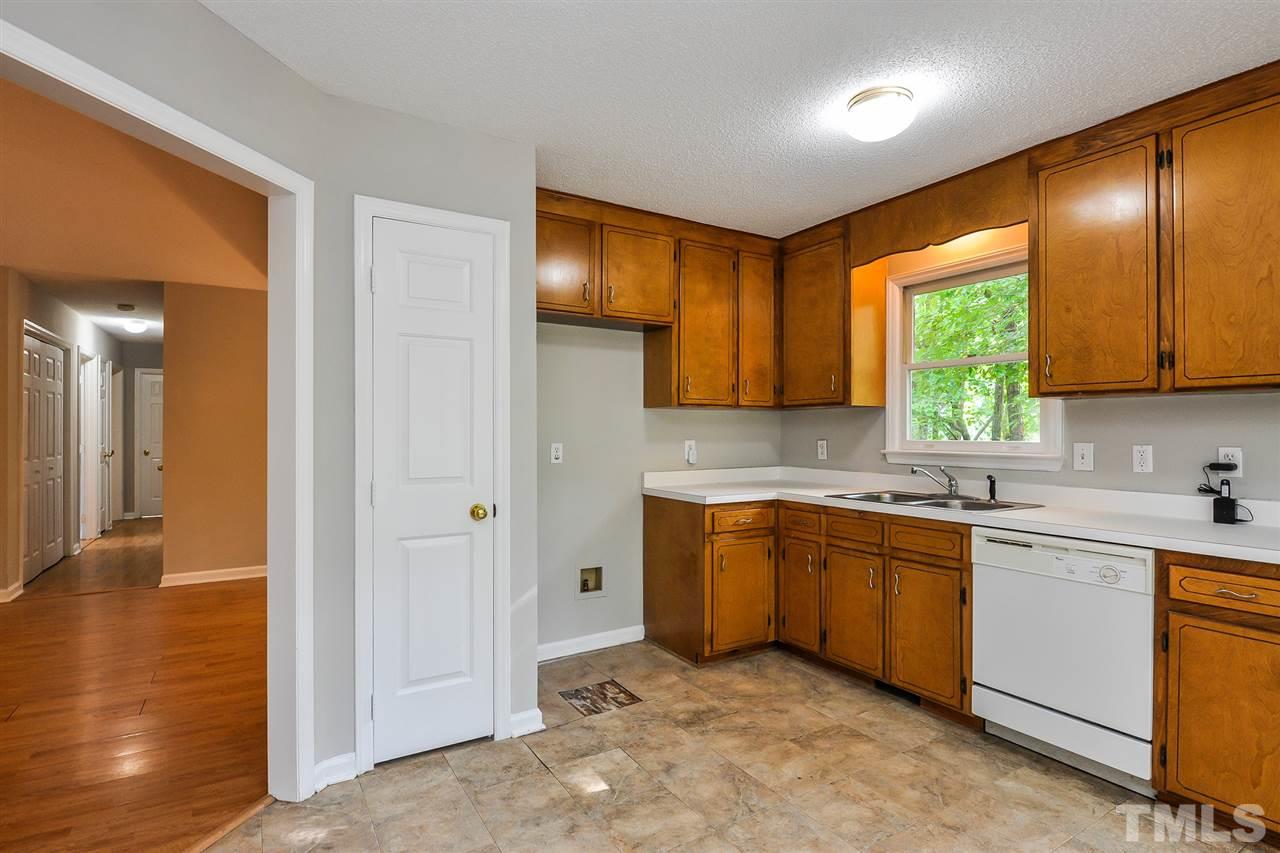 5208 Relay Way Raleigh, NC 27603 - Photo 6 of 25 a kitchen with stainless steel appliances granite countertop wooden cabinets a sink and dishwasher