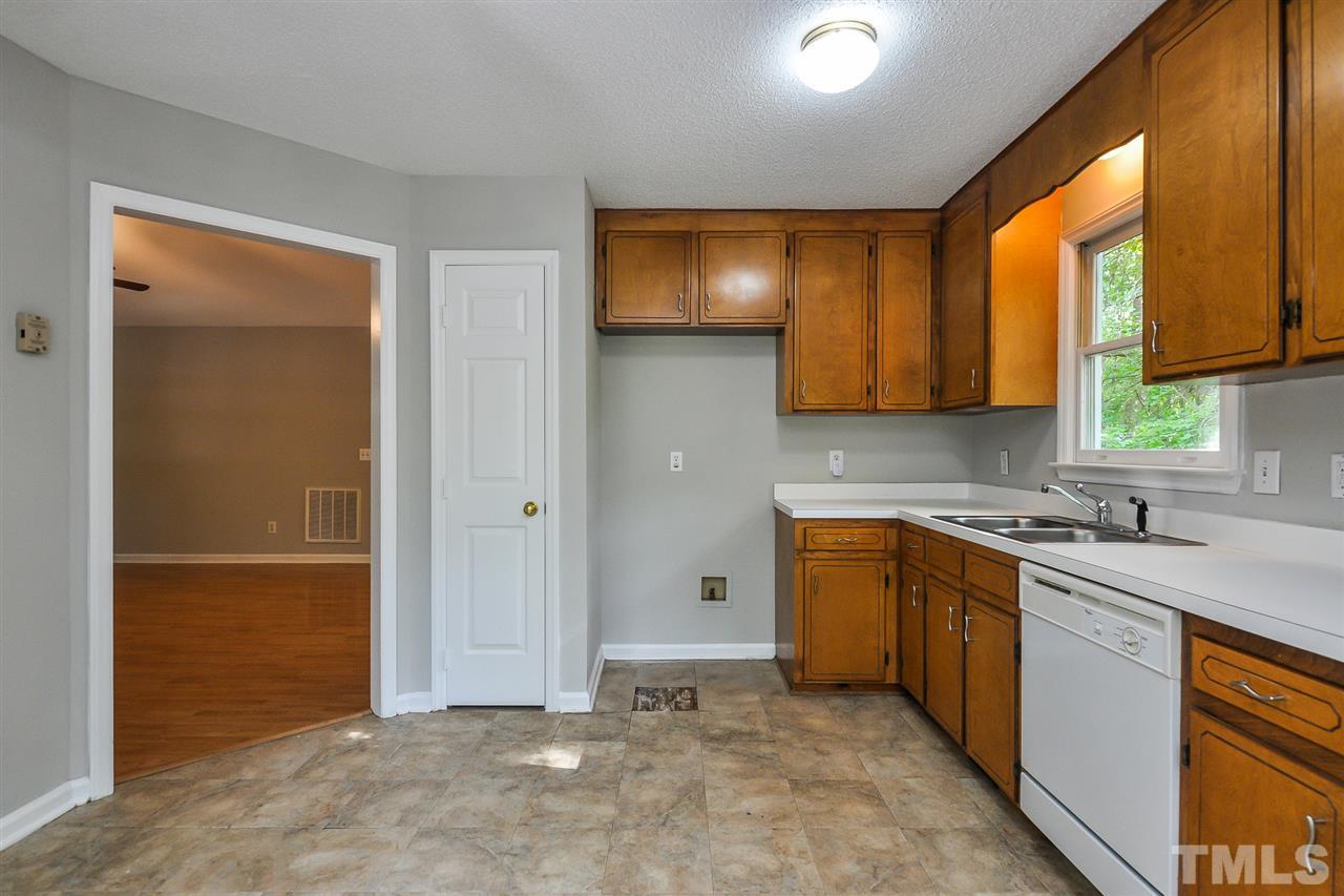 5208 Relay Way Raleigh, NC 27603 - Photo 7 of 25 a kitchen with stainless steel appliances granite countertop a sink stove and cabinets