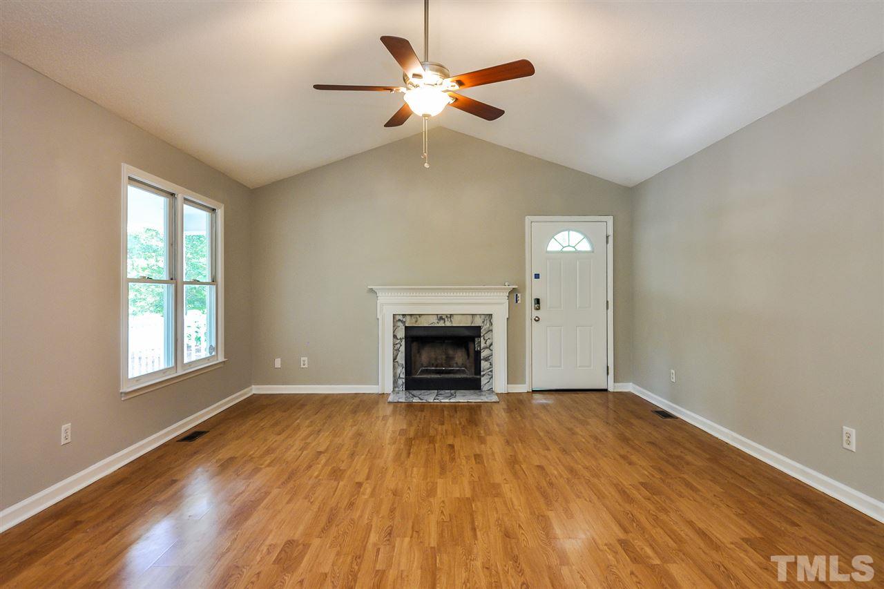 5208 Relay Way Raleigh, NC 27603 - Photo 9 of 25 wooden floor fireplace and windows in a room