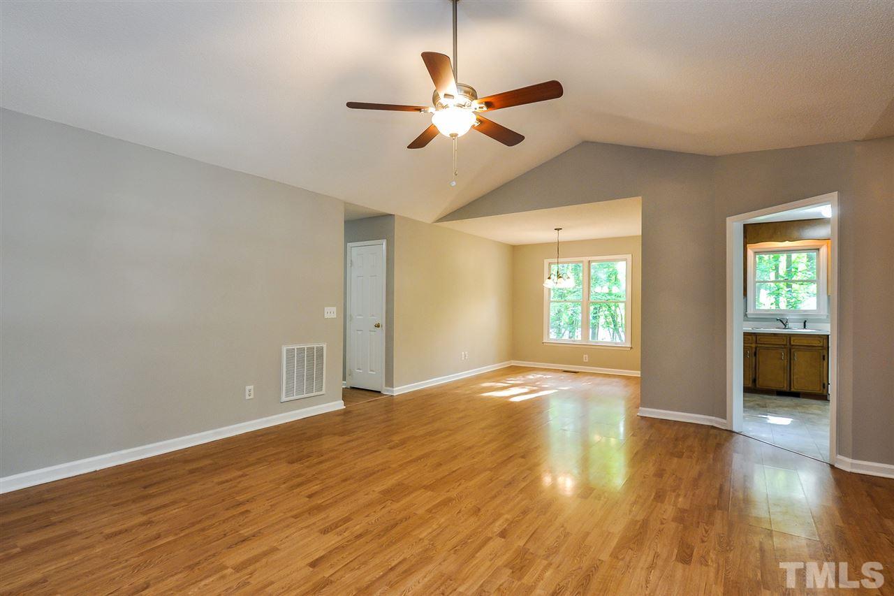 5208 Relay Way Raleigh, NC 27603 - Photo 10 of 25 a view of an empty room with window and wooden floor