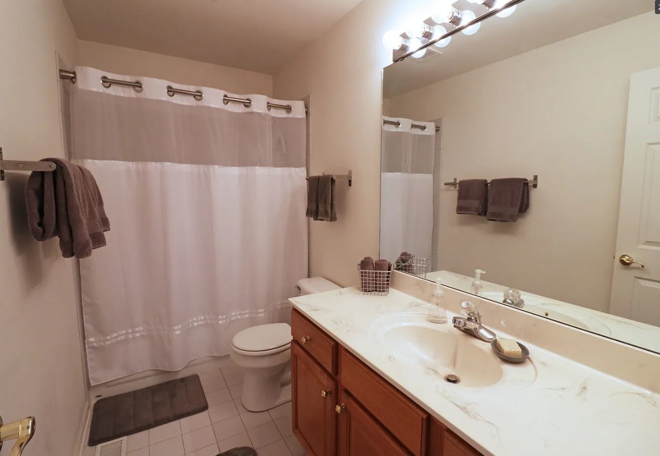 37076 North Bonnie Brae Road Lake Villa, IL 60046 - Photo 13 of 17 a bathroom with a sink toilet and shower