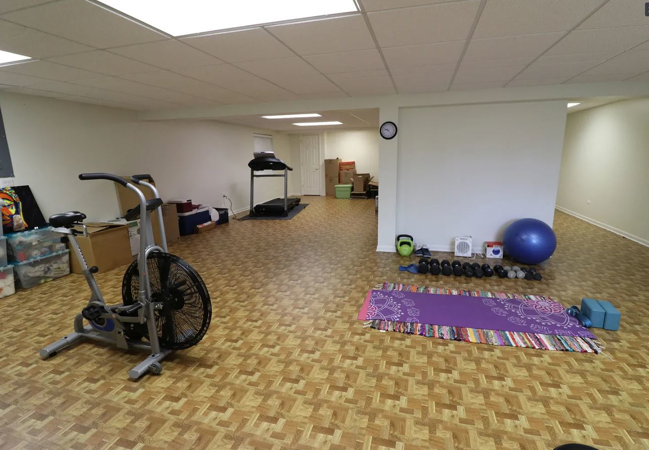 37076 North Bonnie Brae Road Lake Villa, IL 60046 - Photo 14 of 17 a room with gym equipment and wooden floor