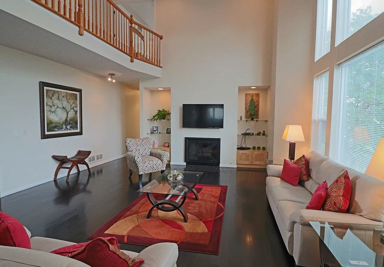 37076 North Bonnie Brae Road Lake Villa, IL 60046 - Photo 4 of 17 a living room with fireplace furniture and a flat screen tv