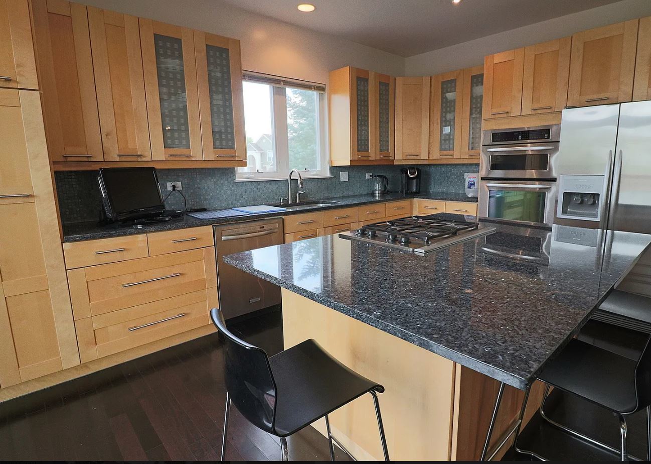 37076 North Bonnie Brae Road Lake Villa, IL 60046 - Photo 6 of 17 a kitchen with stainless steel appliances granite countertop a sink a stove and cabinets
