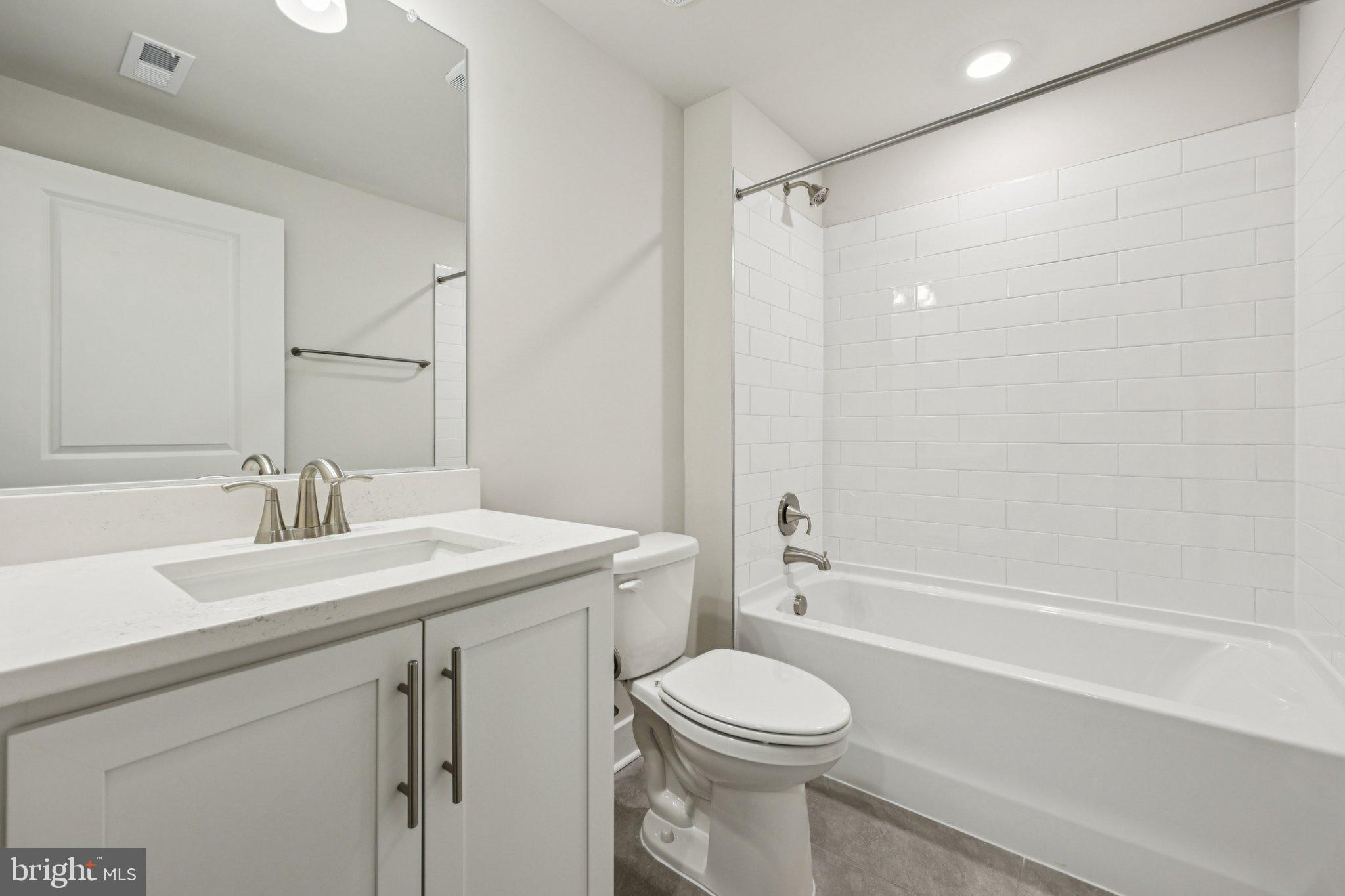 234 Hydrangea Way Winchester, VA 22602 - Photo 30 of 54 a bathroom with a sink a toilet and shower
