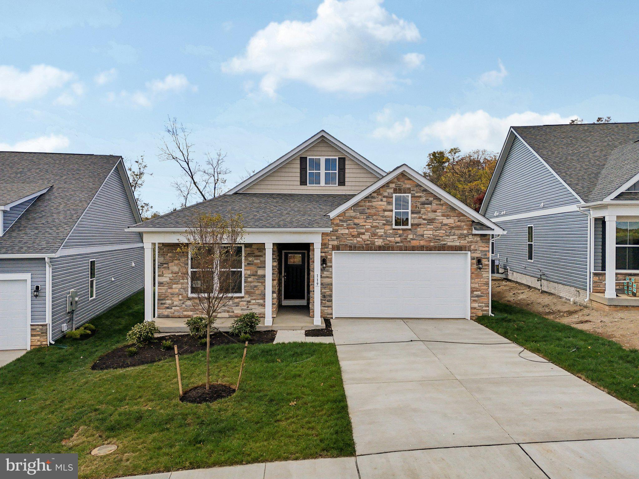 234 Hydrangea Way Winchester, VA 22602 - Photo 37 of 54 a front view of house with backyard and green space