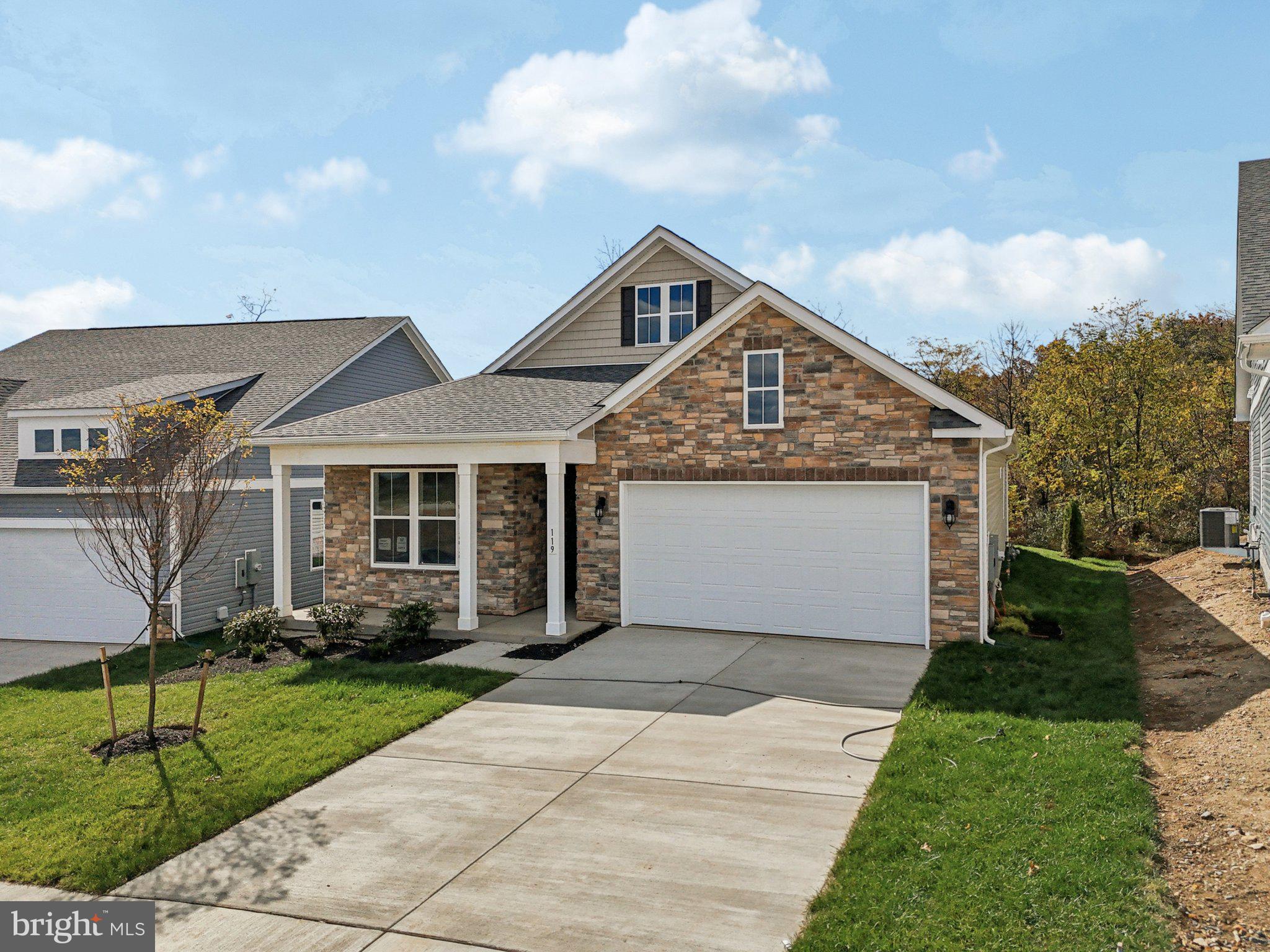 234 Hydrangea Way Winchester, VA 22602 - Photo 41 of 54 a front view of a house with a garden and trees