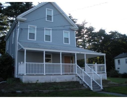 113 Rockland Street, Unit 1 Canton, MA 02021 - Photo 8 of 9 a view of a house with a window and wooden fence