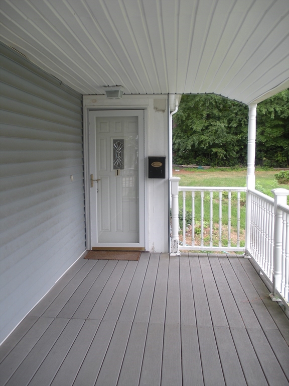 113 Rockland Street, Unit 1 Canton, MA 02021 - Photo 9 of 9 a view of a wooden deck