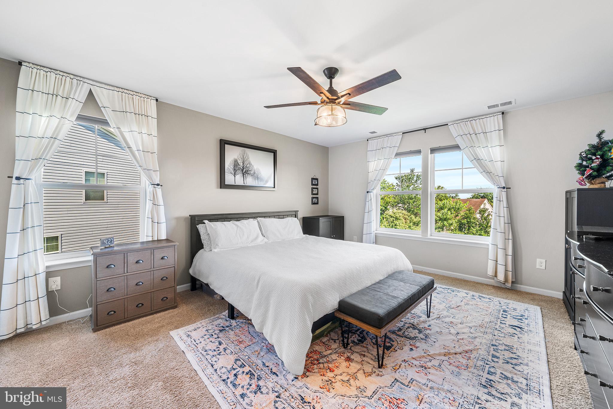 43 Hummingbird Lane Phoenixville, PA 19460 - Photo 26 of 44 a spacious bedroom with a bed and a flat screen tv
