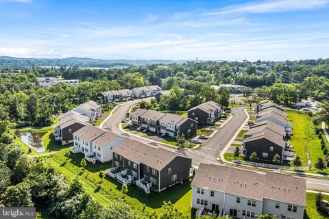an aerial view of a house with a garden