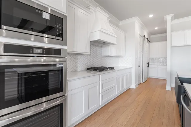 a view of cabinets and wooden floor