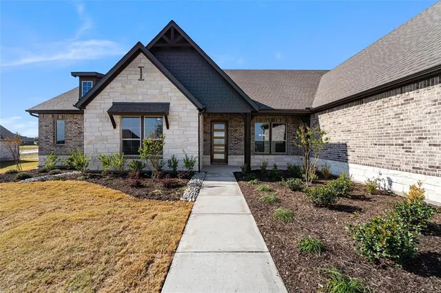 a front view of a house with yard