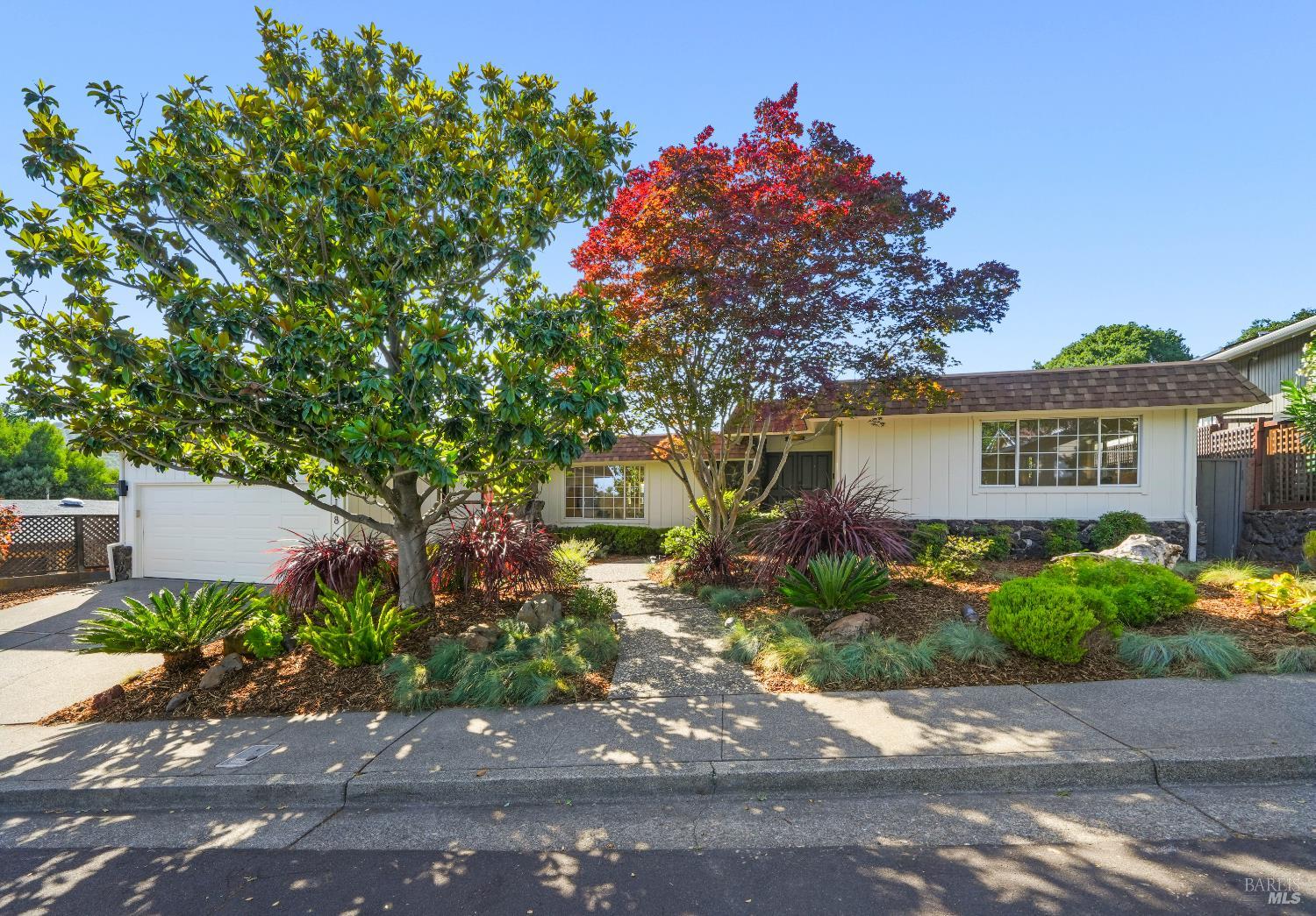 148 Dominican Drive San Rafael, CA 94901 - Photo 1 of 60 a front view of a house with a yard and garage