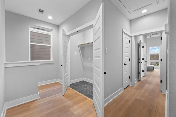 a room that has a bed and a window