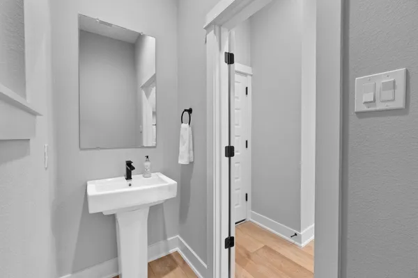 a bathroom with a sink and mirror