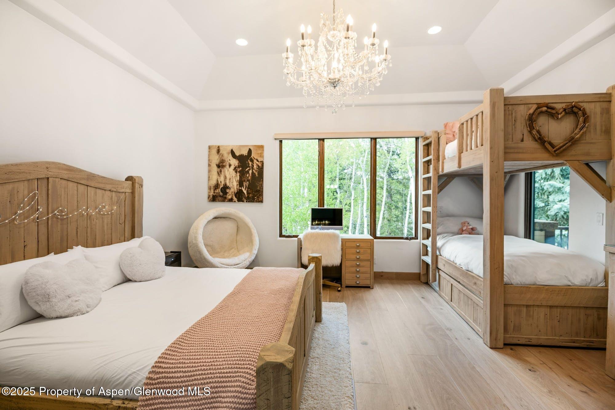 350 Spruce Ridge Lane Snowmass Village, CO 81615 - Photo 22 of 38 a bedroom with furniture and a large window