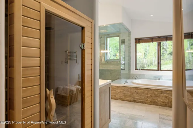 a spacious bathroom with a tub and shower